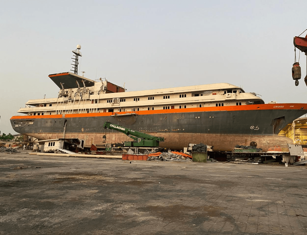 Scrap ship buyers in Dubai – Decommissioned vessel being dismantled for scrap metal recycling at an industrial scrapyard.